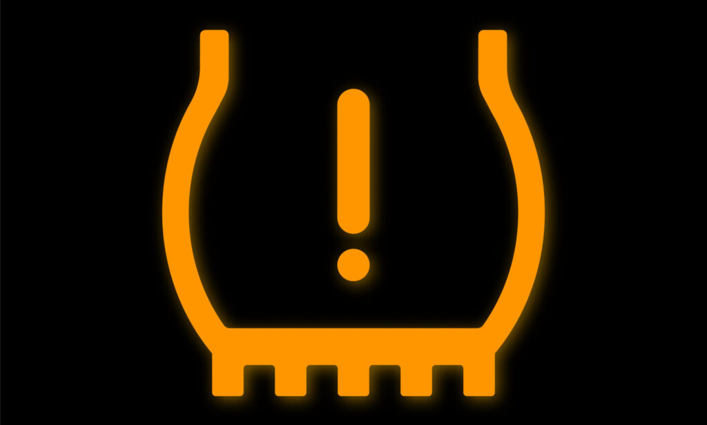Low tire pressure warning light on car dashboard. Checking pressure gauge. Tire pressure gauge. Vector illustration.