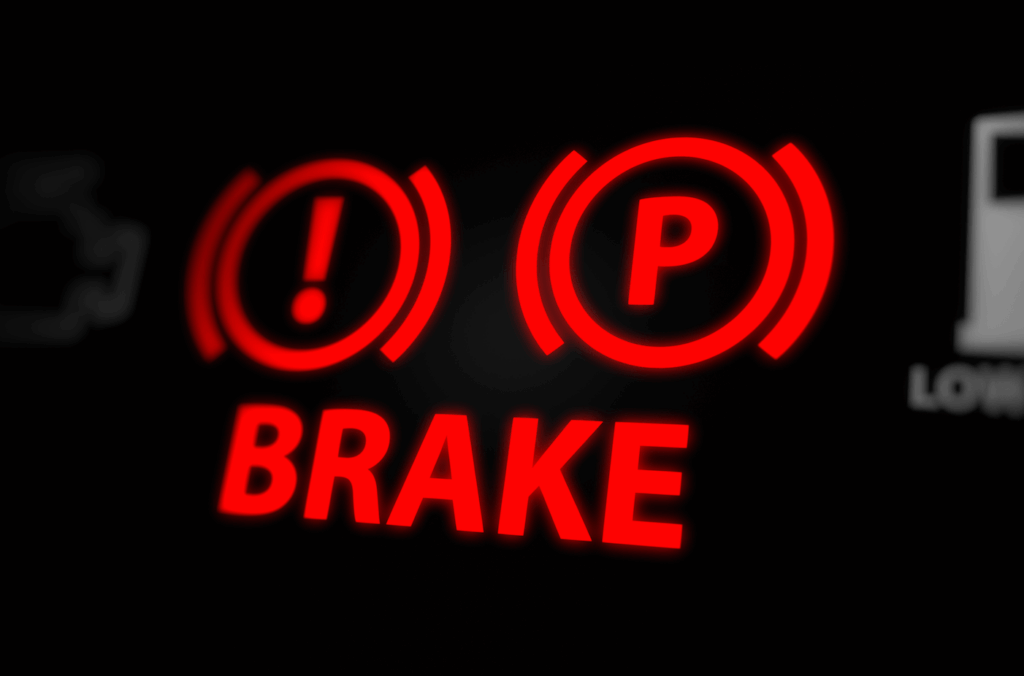 close up of brake light indicator on the dashboard of a vehicle